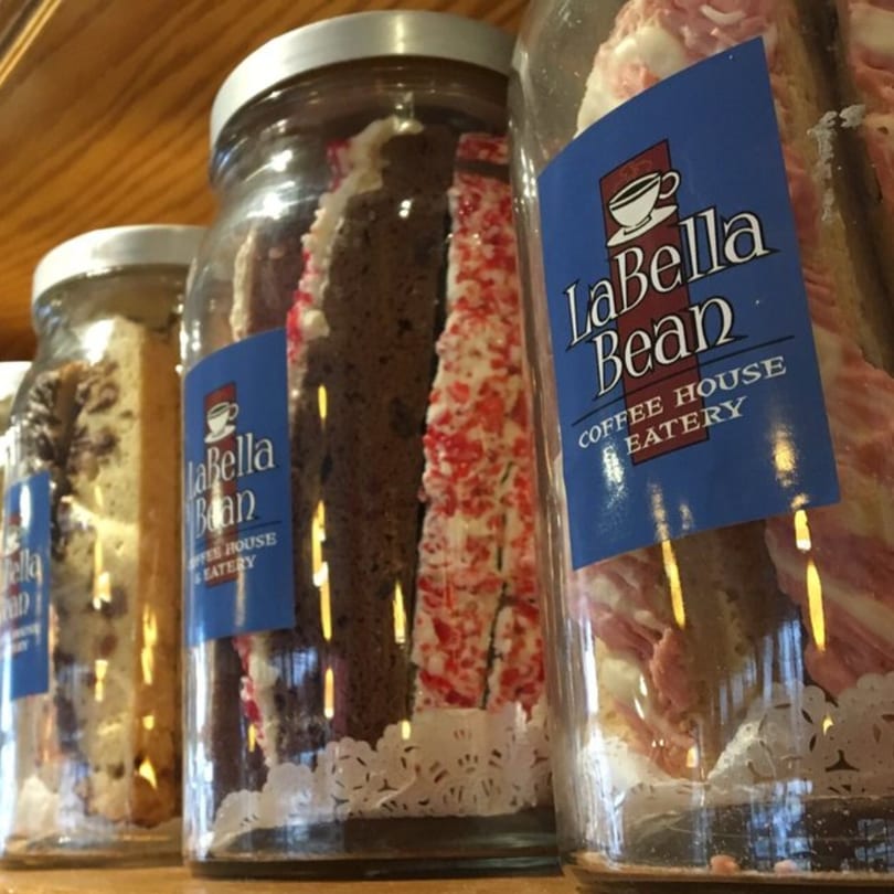 Dessert jars from La Bella Bean Coffee House Eatery, including chocolate and red-sprinkled cakes.